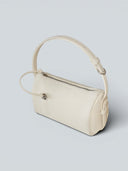 Reco Casa ivory leather baguette bag with adjustable strap and signature key charm detail.