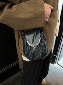 Reco. Clam Shell crossbody bag in cyan blue oil-waxed cowhide with kiss-lock clasp and natural pleats.