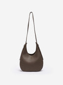 Reco Halston crescent shoulder bag in raw umber Togo calfskin with a minimal, slouchy silhouette.