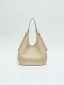 Reco Halston white shell shoulder bag in textured Togo calfskin with a minimal, streamlined silhouette.