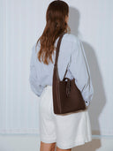 Reco Key Hobo (22) rosewood pebbled leather shoulder bag with key closure and contrast stitching.