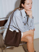 Reco Key Hobo (22) rosewood pebbled leather hobo bag with key closure and contrast stitching.