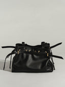 Reco L'erreur black leather drawstring bucket bag with gold hardware and adjustable straps.
