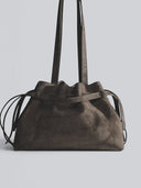 Reco L'erreur dumpling bag in Falcon Gray Nubuck leather with drawstring top and clean geometric base.