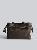 Reco L'erreur dumpling bag in Falcon Gray Nubuck leather with drawstring top and geometric base.