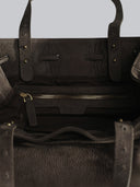 Reco L'erreur dumpling bag in Falcon Gray nubuck leather featuring a zippered interior pocket and brass hardware.