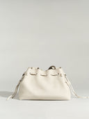 Reco. L'erreur dumpling bag in Fog White pebbled Togo calfskin with a drawstring closure and flat geometric base.