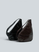 Reco Pottery Jar crossbody bag in night black leather with sculptural, hand-stitched seams. Deep matte black finish.