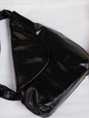Reco Pottery Jar crossbody bag in night black leather with sculptural, wheel-thrown vessel-inspired design and hand-stitched seams.