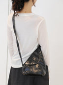 Reco Pottery Jar crossbody bag in night black leather with a sculptural, wheel-thrown vessel design and hand-stitched seams.