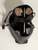 Reco Ordo midnight black Napa leather dumpling tote bag with interior laptop and shoe storage, top-down view.