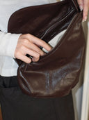 Reco Pottery Jar crossbody bag in ebony red oil-waxed full-grain cowhide leather with a sculptural shape and hand-stitched seams.